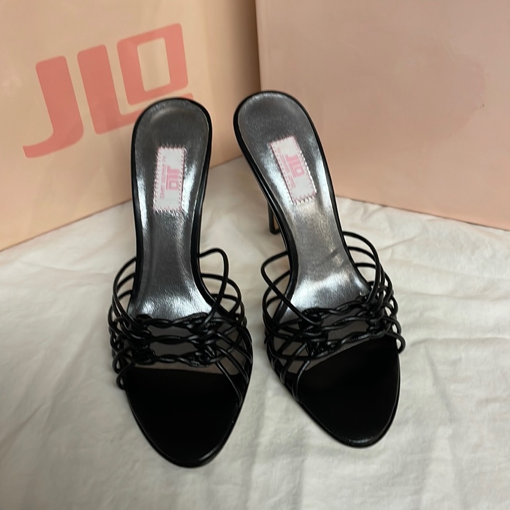 New in original box Jennifer Lopez black leather sandal with 4 inch heel.